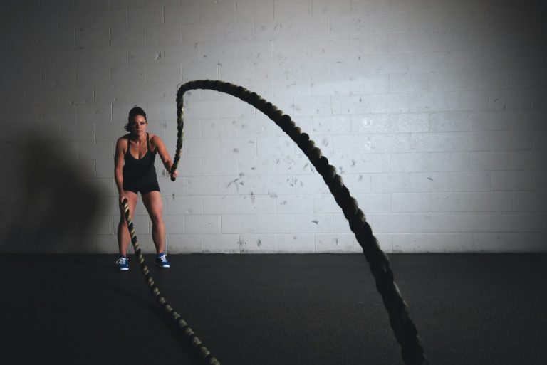 woman holding brown ropes